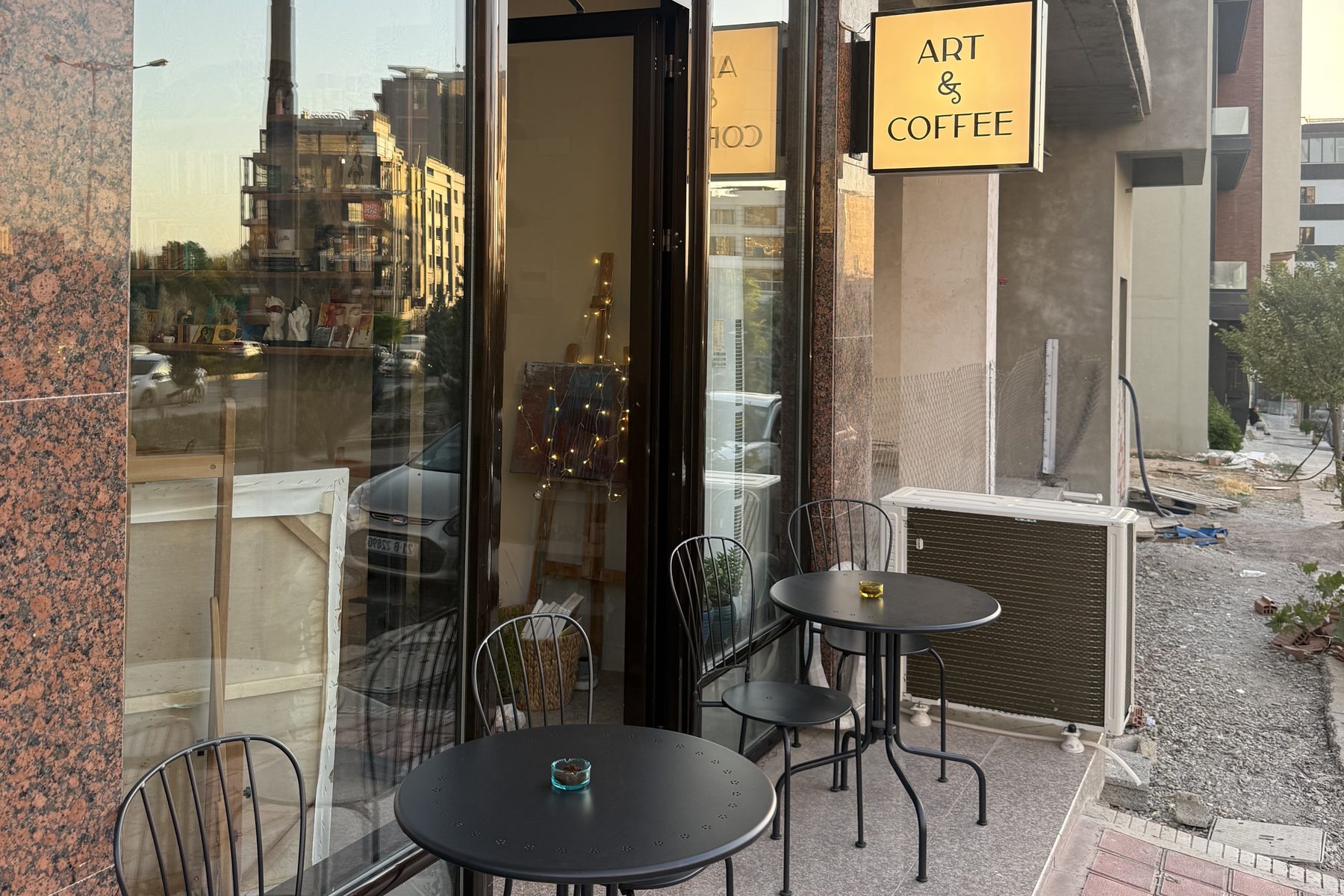 Tables and chairs on the Art & Coffee terrace